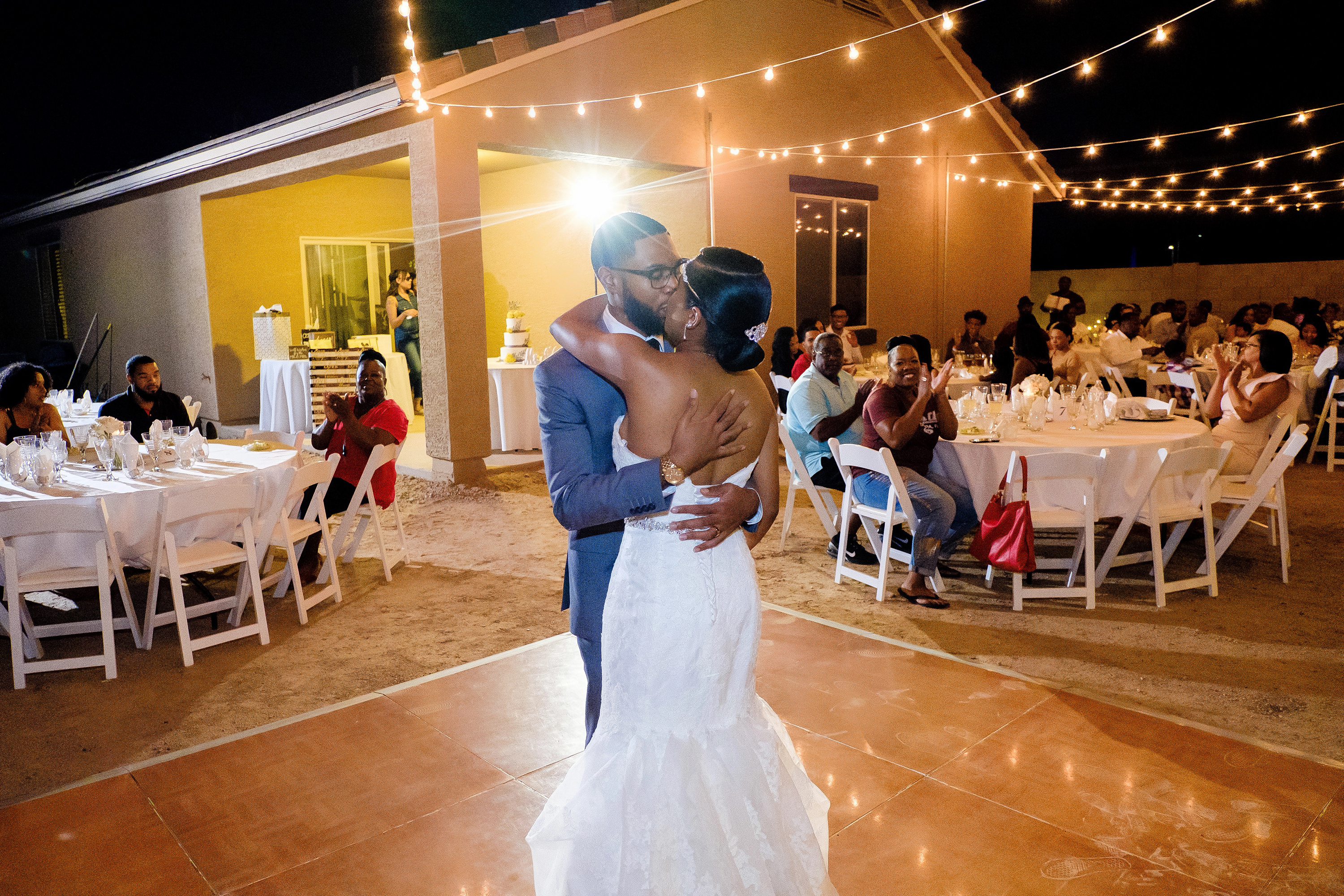 Bride and groom's first dance at their backyard wedding reception