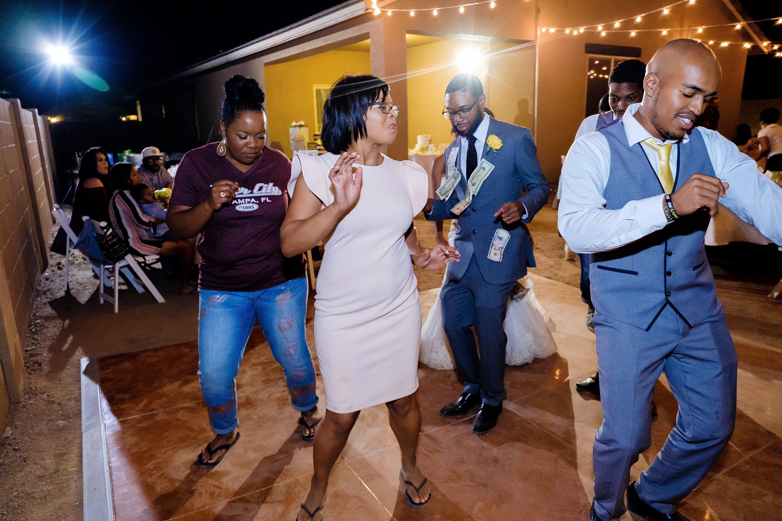 Line dancing at a backyard wedding reception in Phoenix
