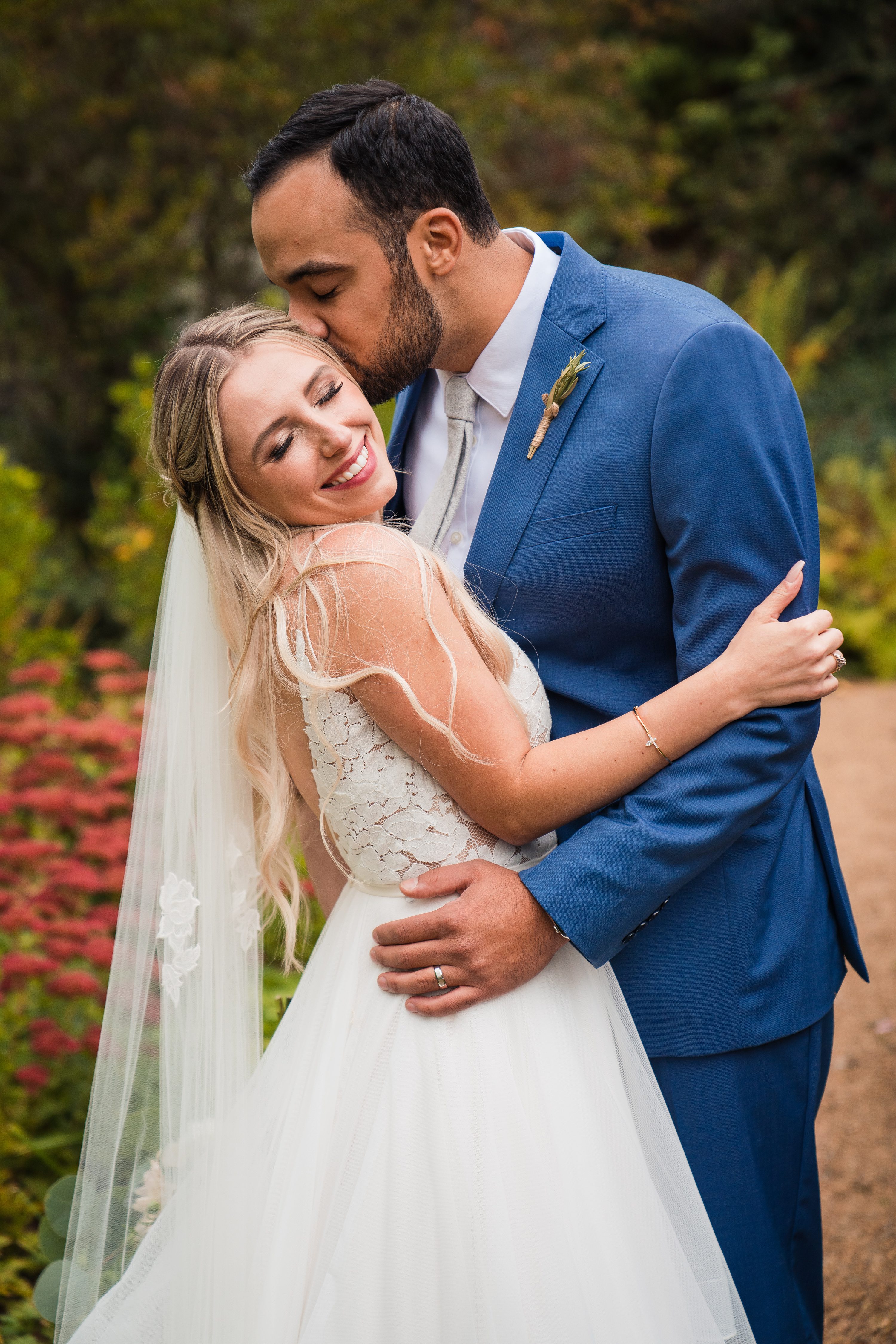 Natural wedding photography,Best wedding photographer boston,groom kissing cheek,blue suits