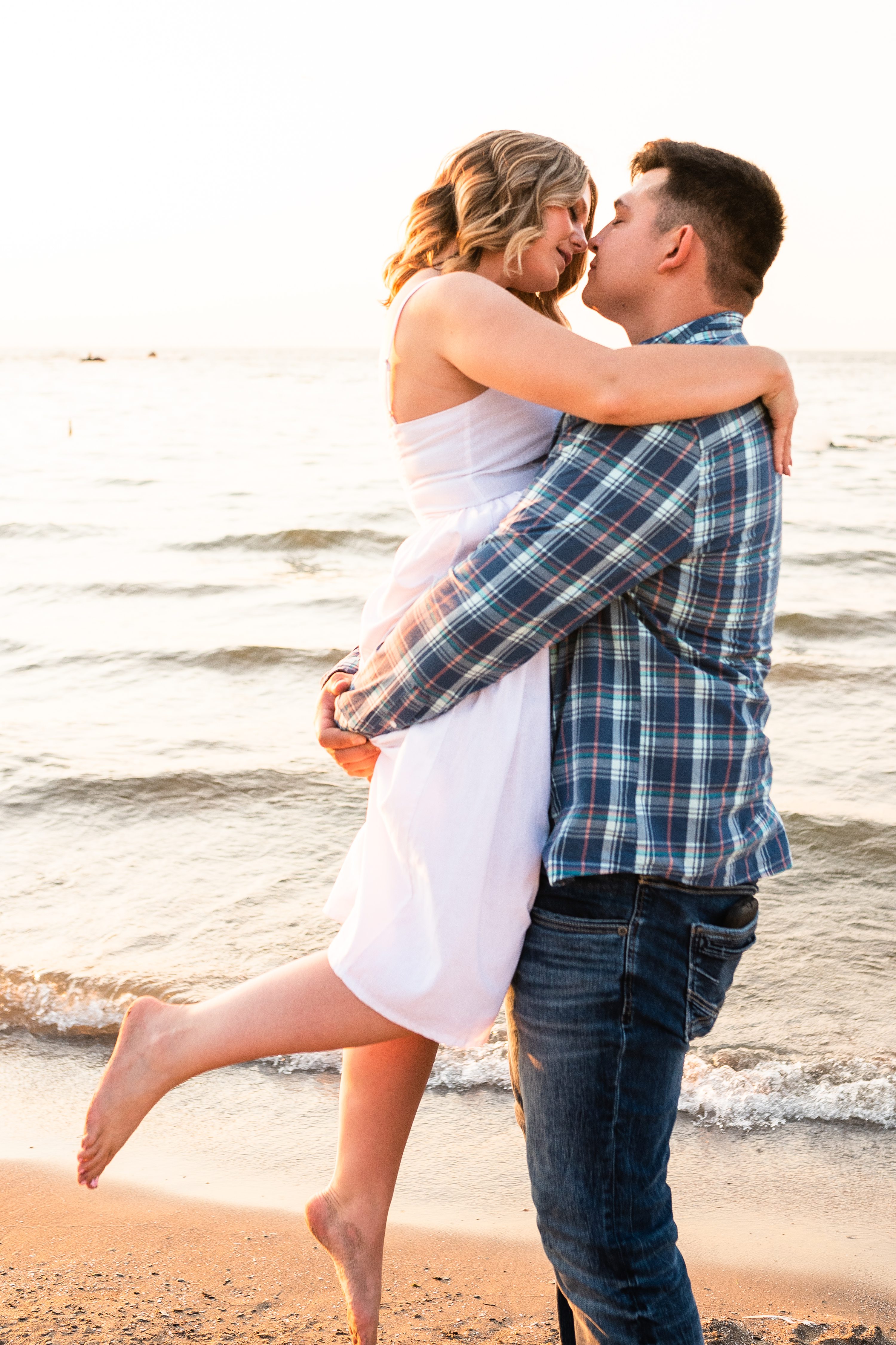 Cleveland Photographer, Downtown Cleveland, Engagement Photographer, Engagement Session, Hannah + Tyler, Hannh and Tyler, Lake Erie, Lake Erie Engagement Session, Lake Erie photos, Ohio Photographer, Wedding Photographer, cleveland engagement photographer, couple in lake, couple in water, couples session, couples session in water, ohio engagement photographer, photos in water, sunset photos