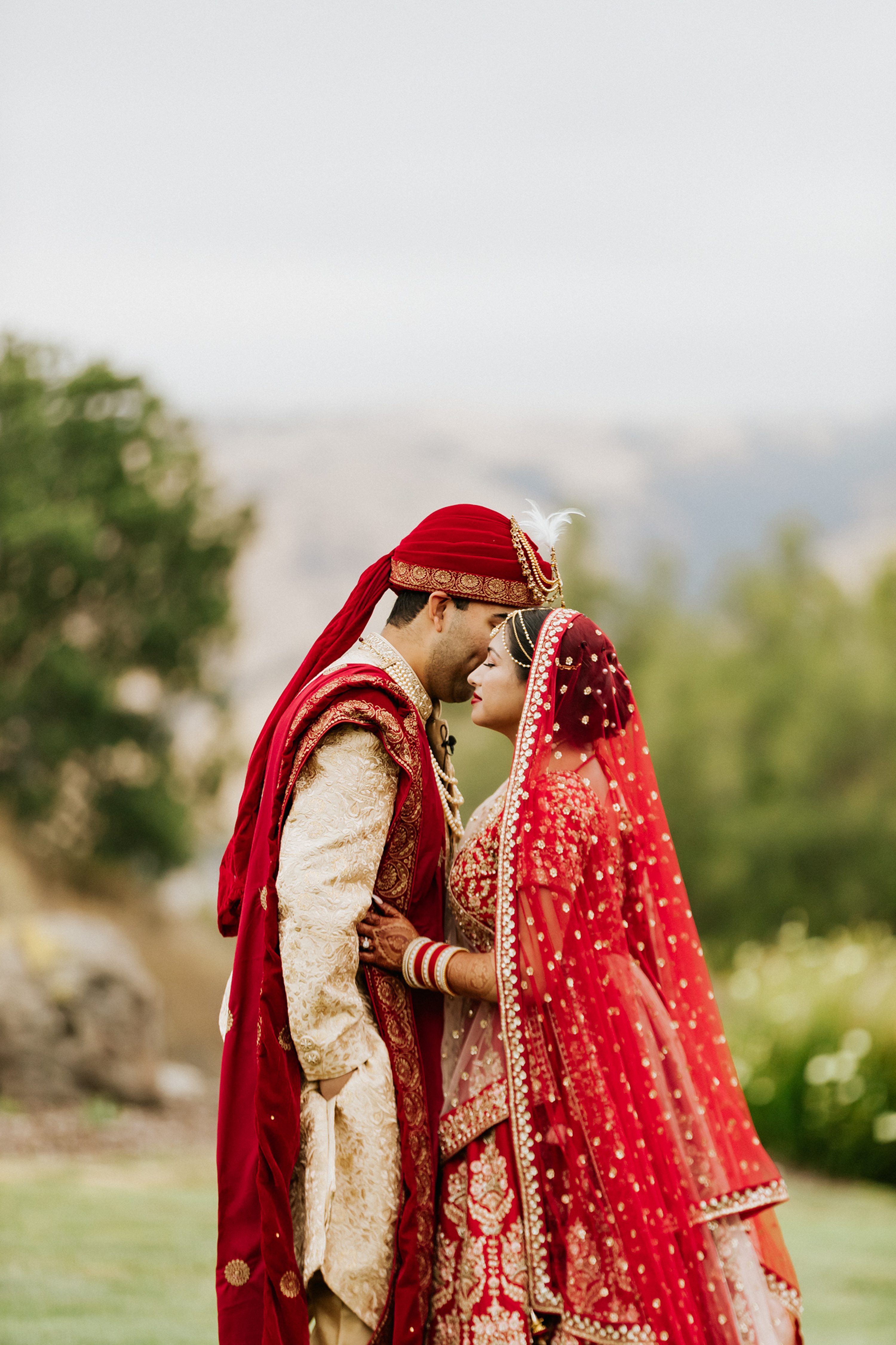 Bride and Groom pose in Red Sox jerseys - Vecoma at the Yellow River