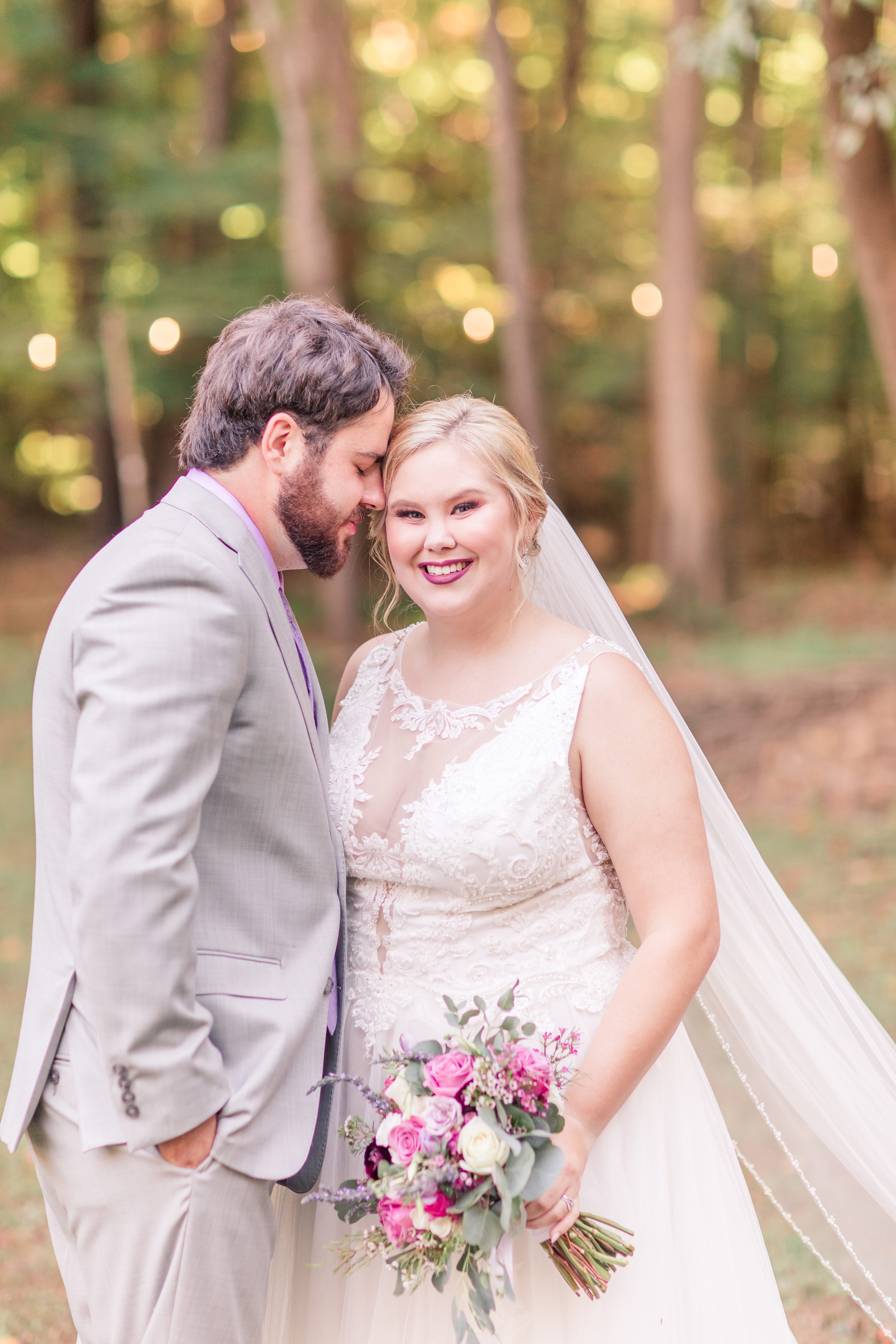 Purple bridemaids dresses, pink and white wedding bouquet.