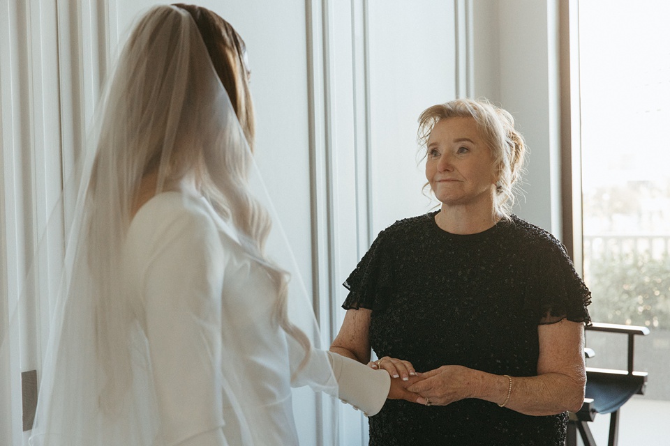 Nola Wedding,Bride and groom exchanging vows in the courtyard of the Four Seasons New Orleans.