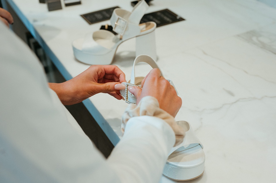 Bride Alexandra in her Vagabond Bridal gown holding a romantic bouquet by Leaf and Petal,Houston Wedding