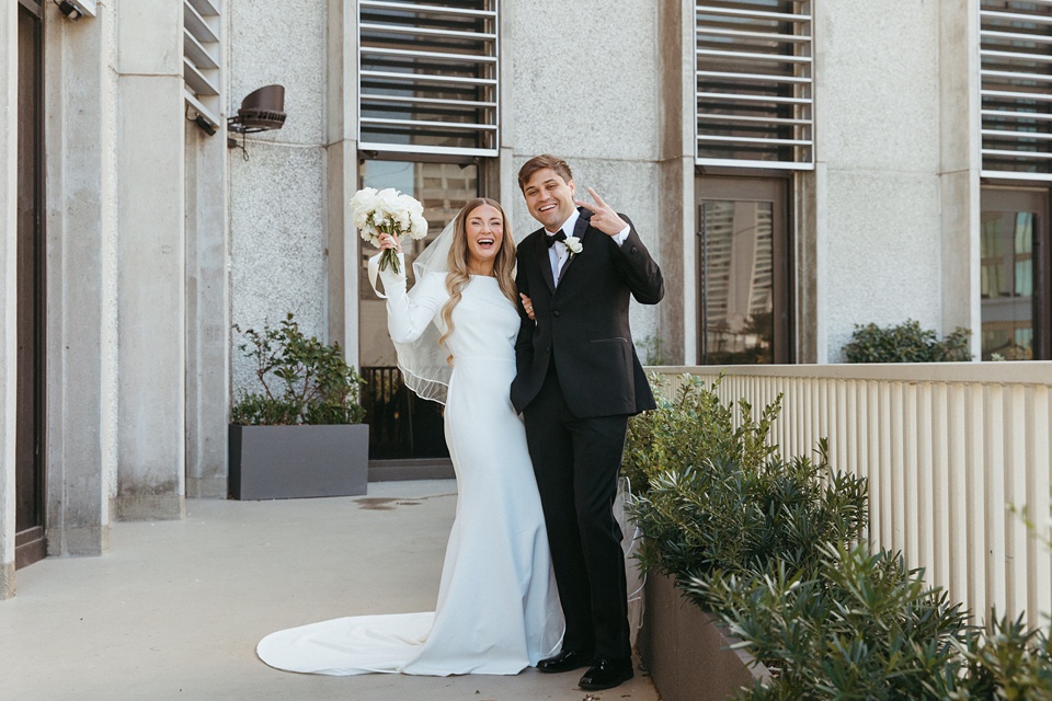 Bride Alexandra in her Vagabond Bridal gown holding a romantic bouquet by Leaf and Petal,Four Seasons New Orleans