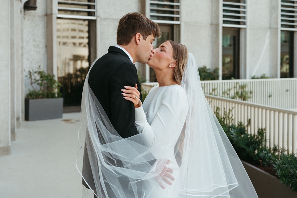 Bride and groom exchanging vows in the courtyard of the Four Seasons New Orleans.,The Four Seasons courtyard set up for an intimate outdoor wedding ceremony.