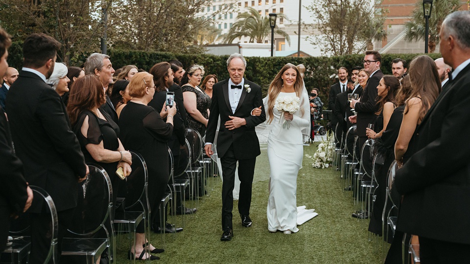 Bride Alexandra in her Vagabond Bridal gown holding a romantic bouquet by Leaf and Petal,Romantic floral arrangements by Leaf and Petal