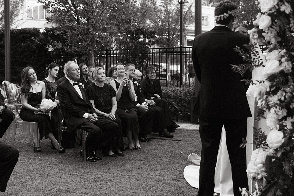 Bride Alexandra in her Vagabond Bridal gown holding a romantic bouquet by Leaf and Petal,Houston Wedding