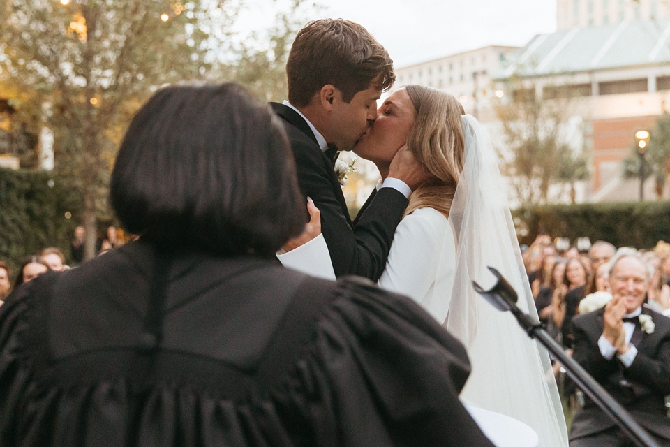 Four Seasons New Orleans,Bride and groom exchanging vows in the courtyard of the Four Seasons New Orleans.