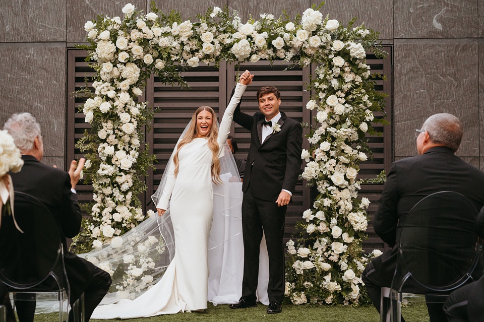 Bride Alexandra in her Vagabond Bridal gown holding a romantic bouquet by Leaf and Petal,Four Seasons New Orleans