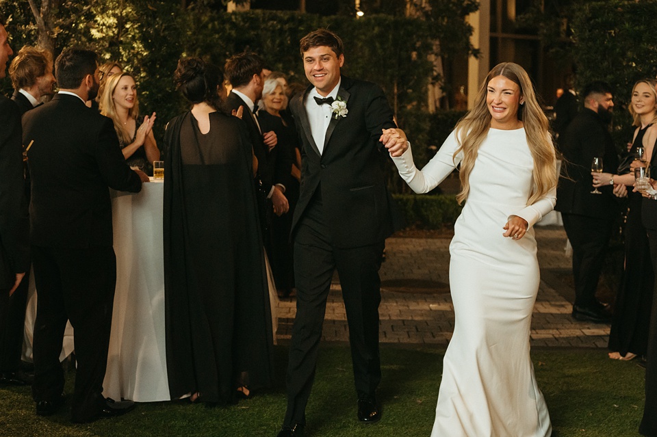 Nola Wedding,Bride and groom exchanging vows in the courtyard of the Four Seasons New Orleans.