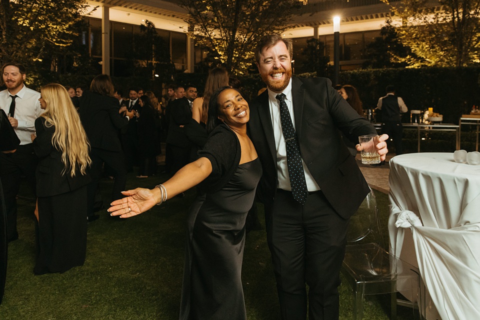 Bride and groom exchanging vows in the courtyard of the Four Seasons New Orleans.,Houston Wedding