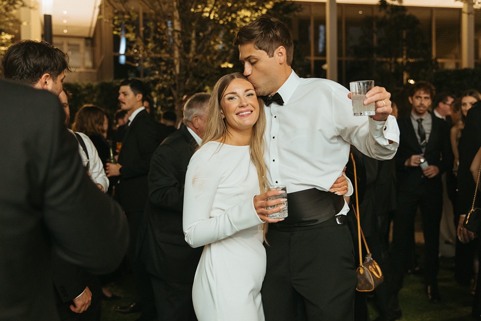 Bride Alexandra in her Vagabond Bridal gown holding a romantic bouquet by Leaf and Petal,Romantic floral arrangements by Leaf and Petal