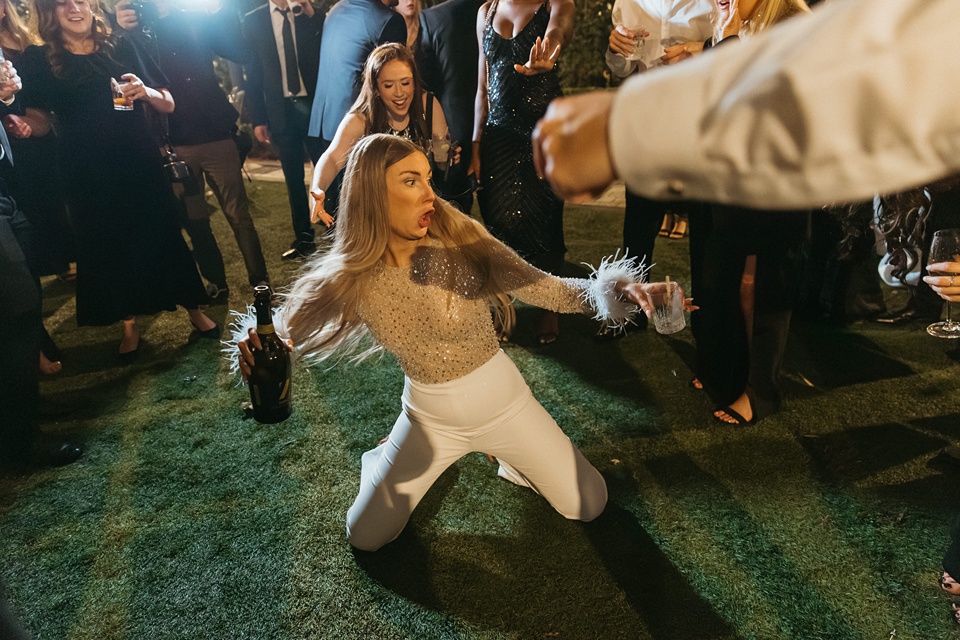 Bride Alexandra in her Vagabond Bridal gown holding a romantic bouquet by Leaf and Petal