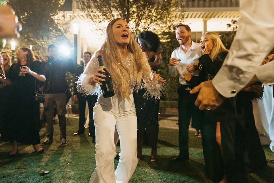 Bride Alexandra in her Vagabond Bridal gown holding a romantic bouquet by Leaf and Petal,Nola Wedding