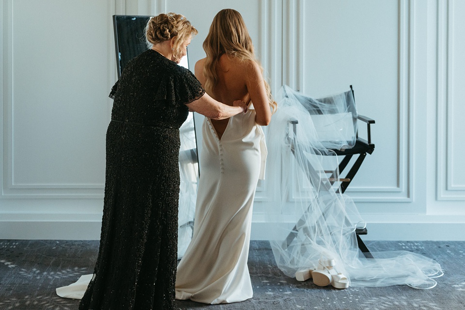 Nola Wedding,Bride Alexandra in her Vagabond Bridal gown holding a romantic bouquet by Leaf and Petal