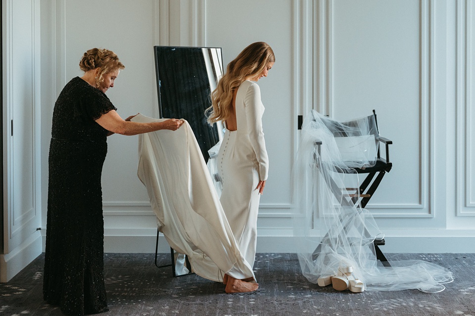 Bride Alexandra in her Vagabond Bridal gown holding a romantic bouquet by Leaf and Petal,Houston Wedding