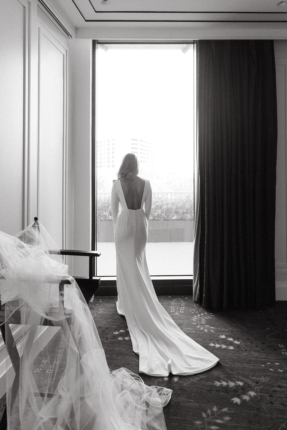 Bride Alexandra in her Vagabond Bridal gown holding a romantic bouquet by Leaf and Petal