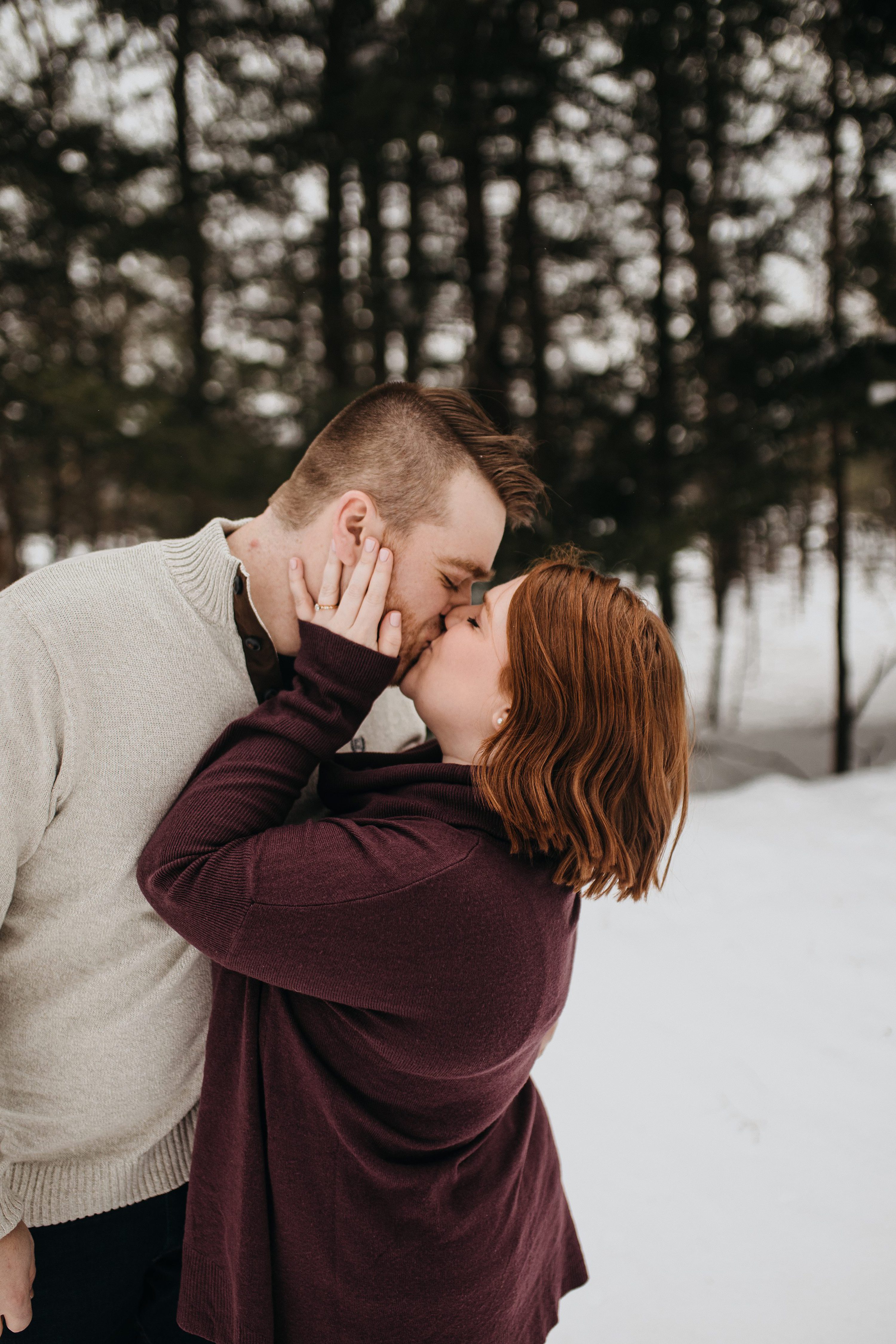 snowy outdoor engagement session,couples photos outdoor,cute couples photos,copper falls state park,copper falls state park engagement session,candid engagement session,winter couples photos,winter engagement session