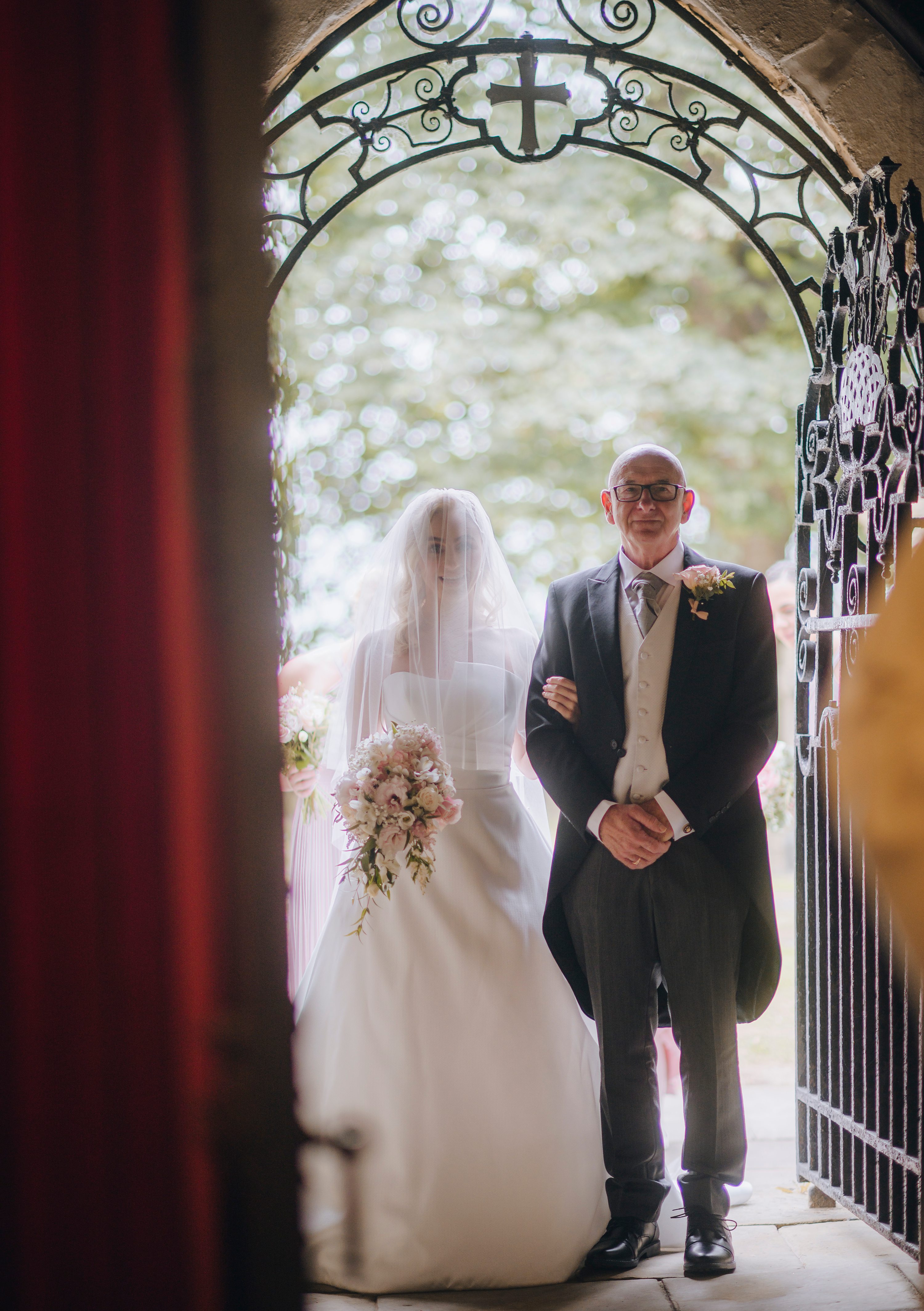 reportage wedding photography,Bagden Hall weddings,St Peter's Church, Tankersley wedding photo,bride and father wait at church door