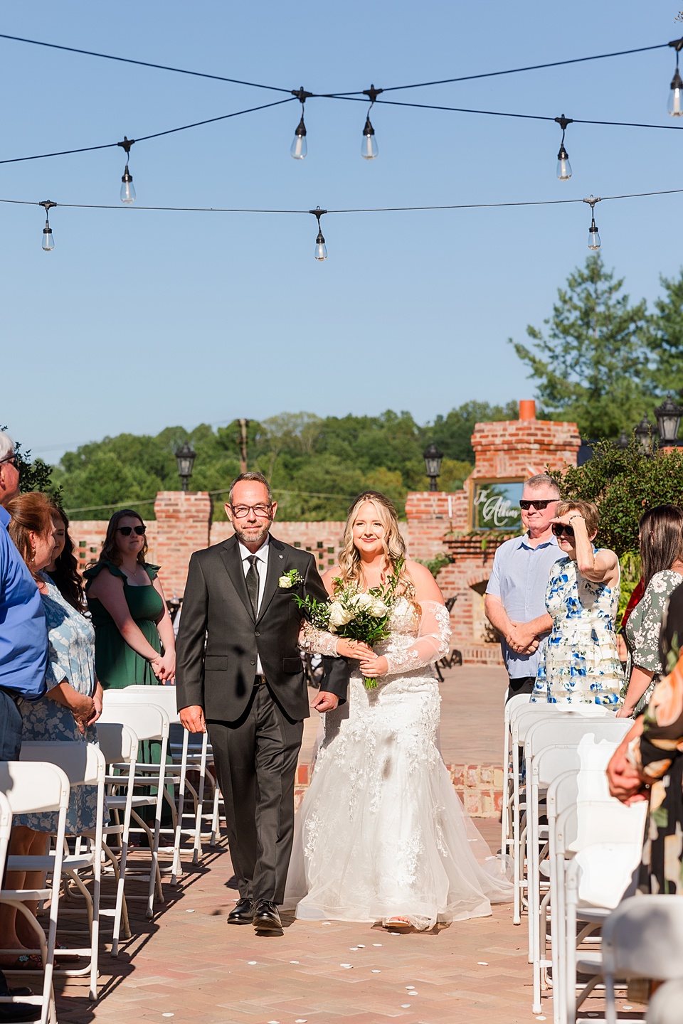 The Blanton House: A Historic Wedding Venue with Timeless Charm outdoor ceremony,white floral