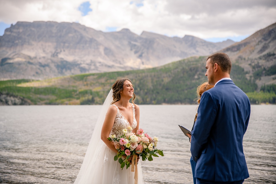 Perfect Lakeside elopement at Rising Sun along St. Mary Lakeshore in Glacier National Park surrounded by friends and family.,Mountain Wedding,Adventure Elopement