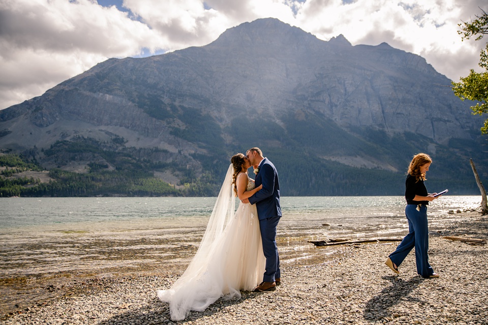 Perfect Lakeside elopement at Rising Sun along St. Mary Lakeshore in Glacier National Park surrounded by friends and family.,Mountain Wedding,Adventure Elopement