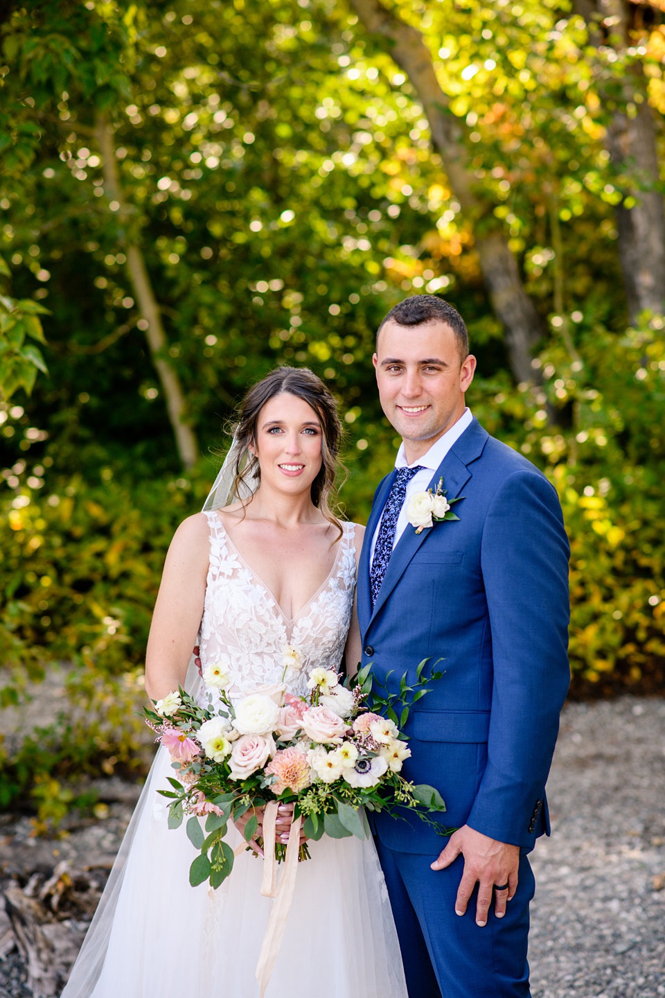 Perfect Lakeside elopement at Rising Sun along St. Mary Lakeshore in Glacier National Park surrounded by friends and family.,Mountain Wedding,Adventure Elopement