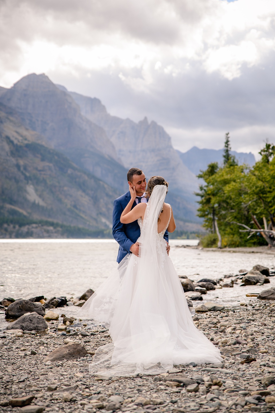 Perfect Lakeside elopement at Rising Sun along St. Mary Lakeshore in Glacier National Park surrounded by friends and family.,Mountain Wedding,Adventure Elopement