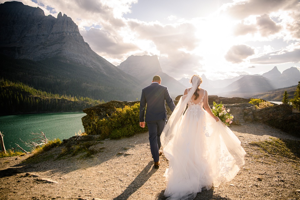 Perfect Lakeside elopement at Rising Sun along St. Mary Lakeshore in Glacier National Park surrounded by friends and family.,Mountain Wedding,Adventure Elopement