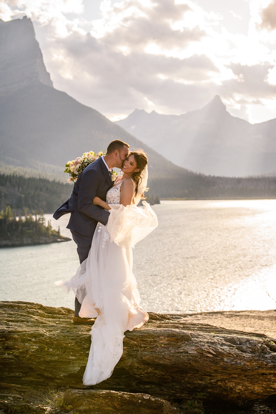 Perfect Lakeside elopement at Rising Sun along St. Mary Lakeshore in Glacier National Park surrounded by friends and family.,Mountain Wedding,Adventure Elopement