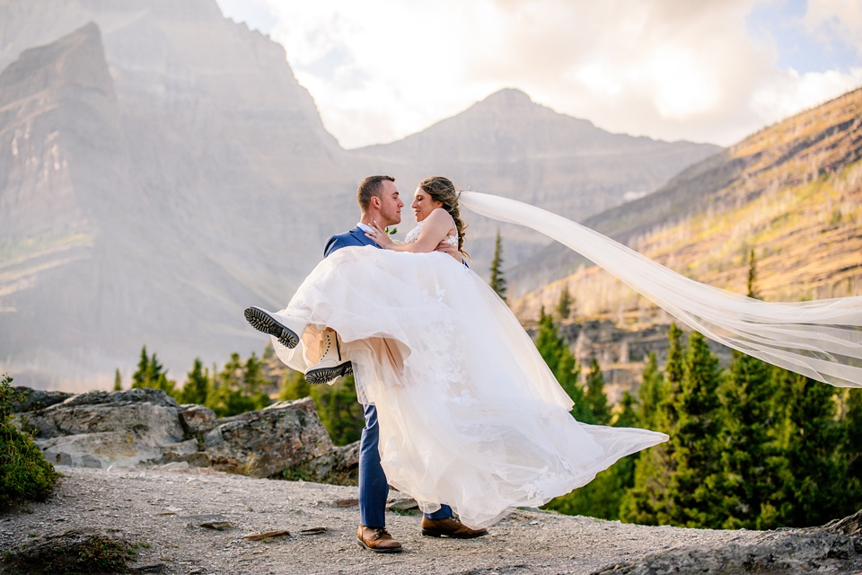 Perfect Lakeside elopement at Rising Sun along St. Mary Lakeshore in Glacier National Park surrounded by friends and family.,Mountain Wedding,Adventure Elopement