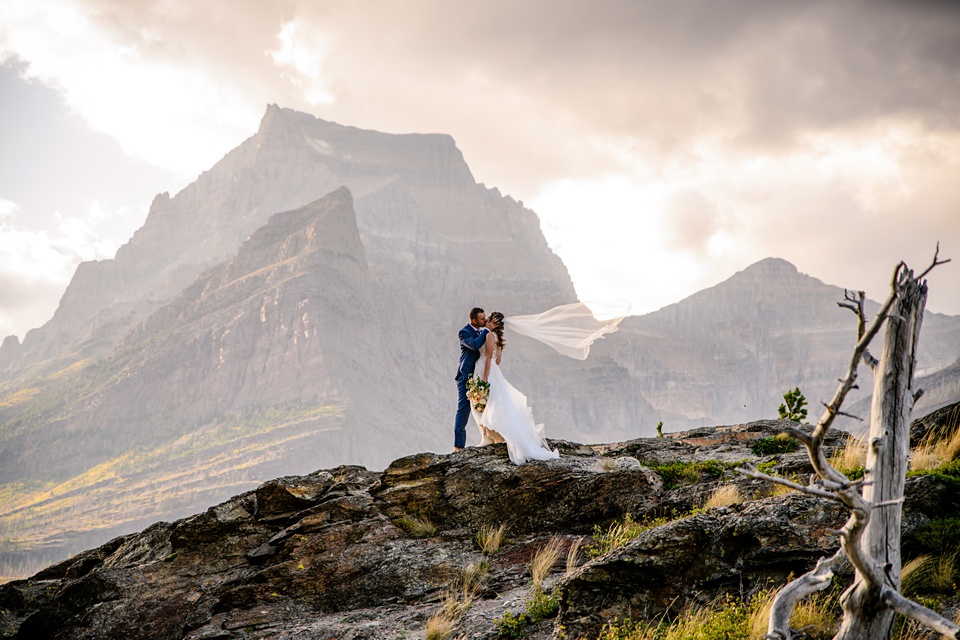 Perfect Lakeside elopement at Rising Sun along St. Mary Lakeshore in Glacier National Park surrounded by friends and family.,Mountain Wedding,Adventure Elopement