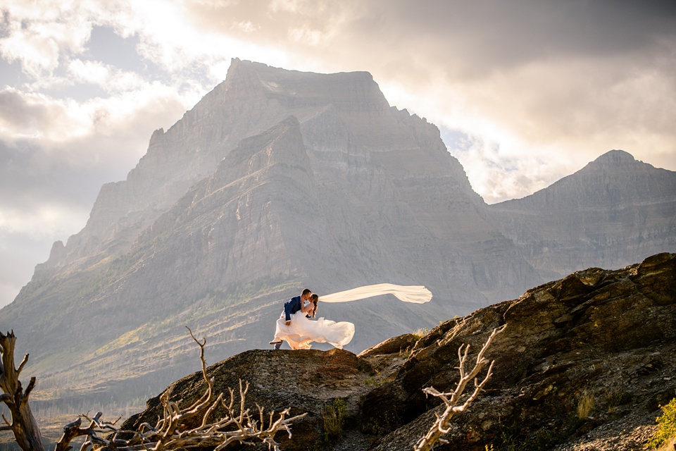 Perfect Lakeside elopement at Rising Sun along St. Mary Lakeshore in Glacier National Park surrounded by friends and family.,Mountain Wedding,Adventure Elopement