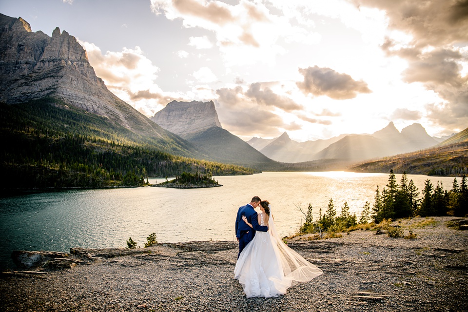 Perfect Lakeside elopement at Rising Sun along St. Mary Lakeshore in Glacier National Park surrounded by friends and family.,Mountain Wedding,Adventure Elopement