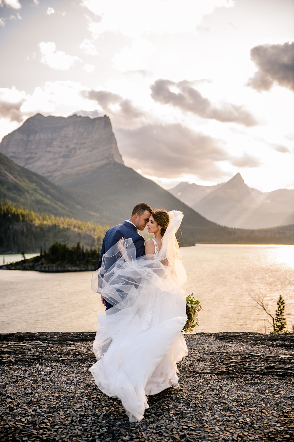 Perfect Lakeside elopement at Rising Sun along St. Mary Lakeshore in Glacier National Park surrounded by friends and family.,Mountain Wedding,Adventure Elopement