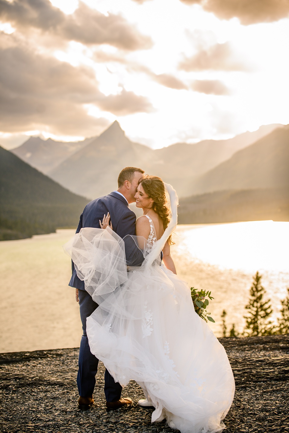 Perfect Lakeside elopement at Rising Sun along St. Mary Lakeshore in Glacier National Park surrounded by friends and family.,Mountain Wedding,Adventure Elopement