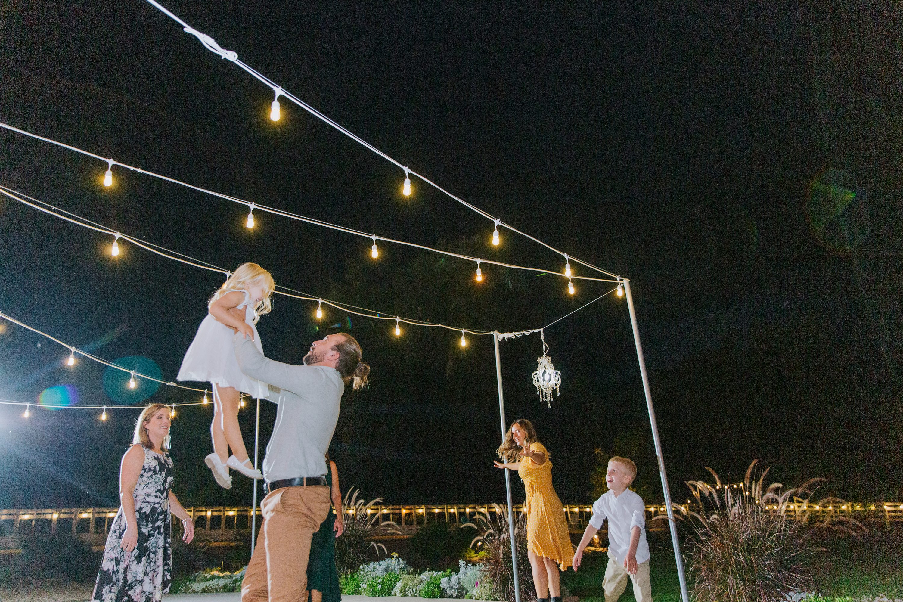 outdoor receptoin,market lights,dancing under lights