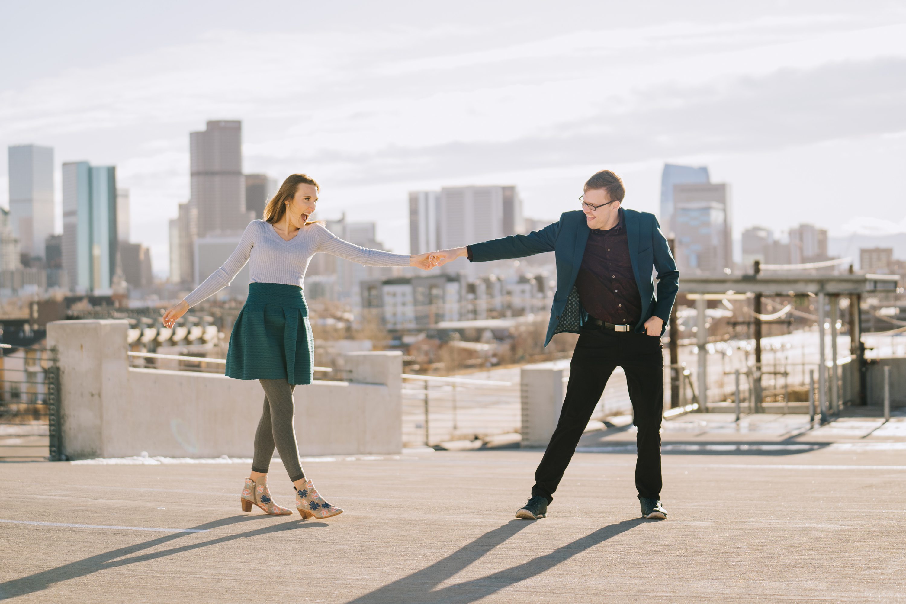 Megan + Eric  Denver Broncos Stadium Engagement Photos - Denver Wedding  Photographers - Elevate BlogDenver Wedding Photographers – Elevate Blog